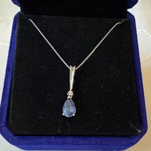 Elegant Sterling Silver Necklace with 2k Blue Topaz and .25 k white Topaz.